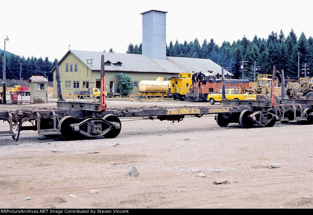 Chehalis Western log car #88. MILW 619 & ex SP caboose in background.